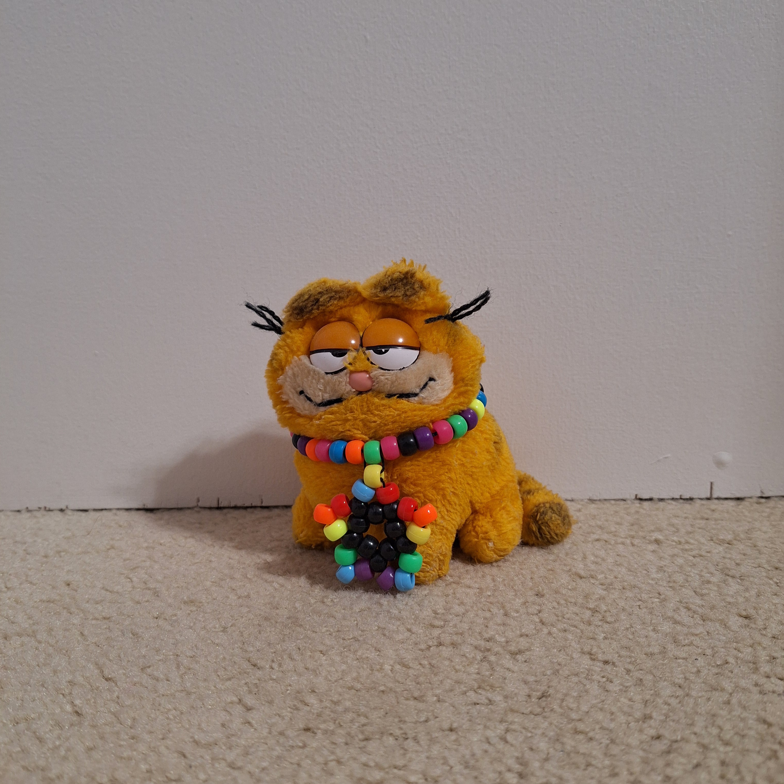 My childhood Garfield. The kandi on his neck is the first single I was ever traded